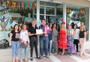 Manuel Cortés entrega el premio al mejor escaparate de Feria a 'Bogas Shop' e inaugura Alfar-Adra